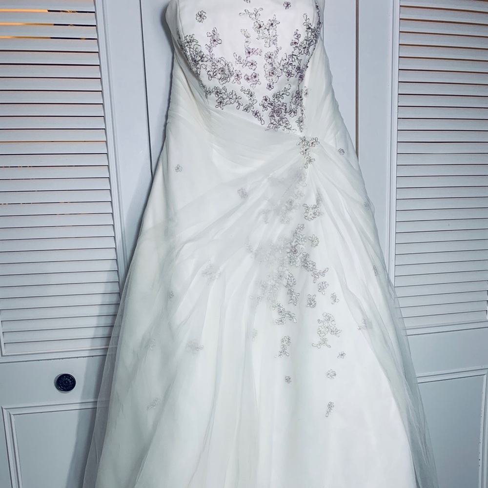An Ivory Monique Lou Wedding dress